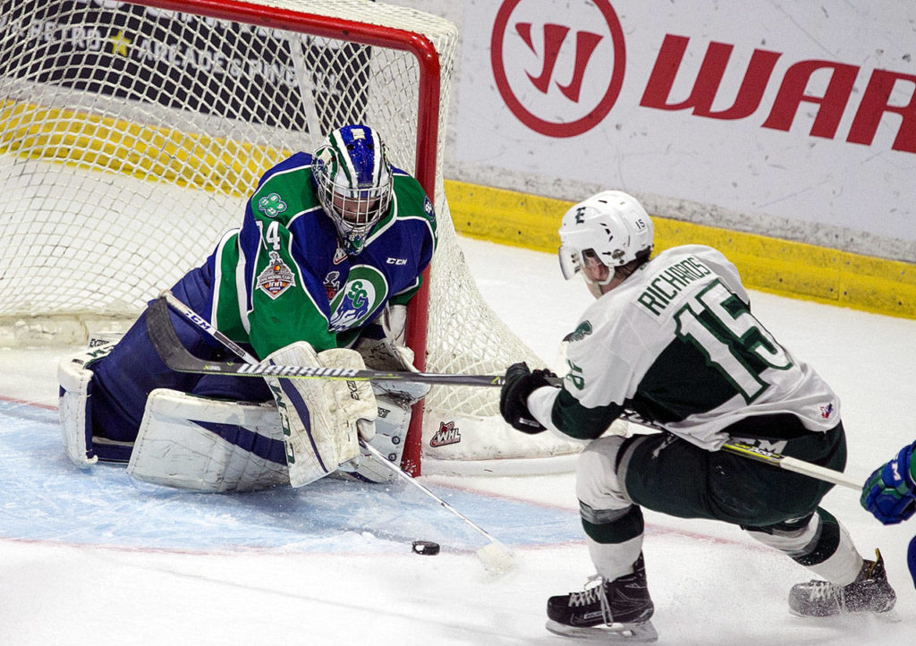 Swift Current goalie Stuart Skinner (left) defends against a shot attempt by the Silvertips’ Sean Richards in the first period of Game 4 of the WHL finals on May 9, 2018, at Angel of the Winds Arena in Everett. (Kevin Clark / The Herald)

