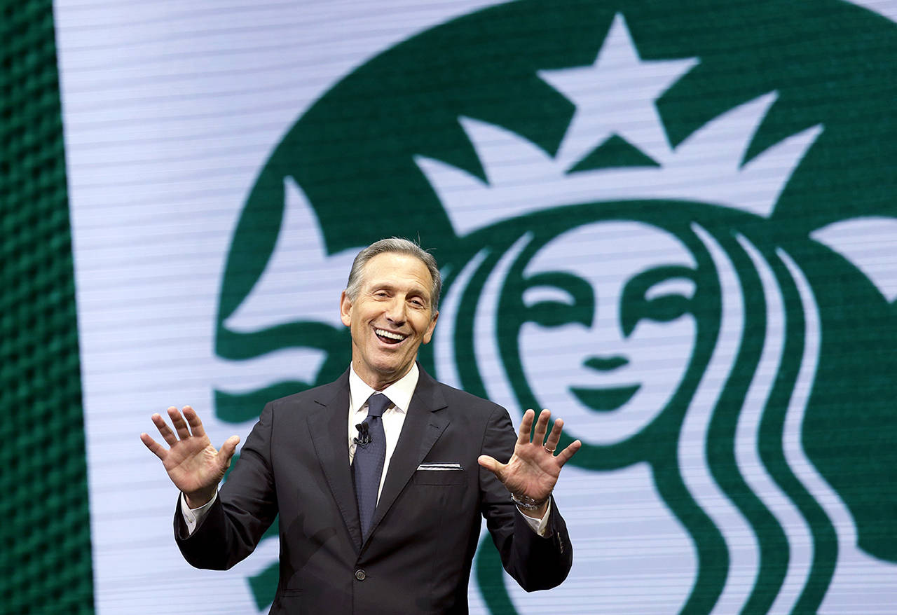 In this 2017 photo, Starbucks CEO Howard Schultz speaks at the Starbucks annual shareholders meeting in Seattle. (AP Photo/Elaine Thompson, File)