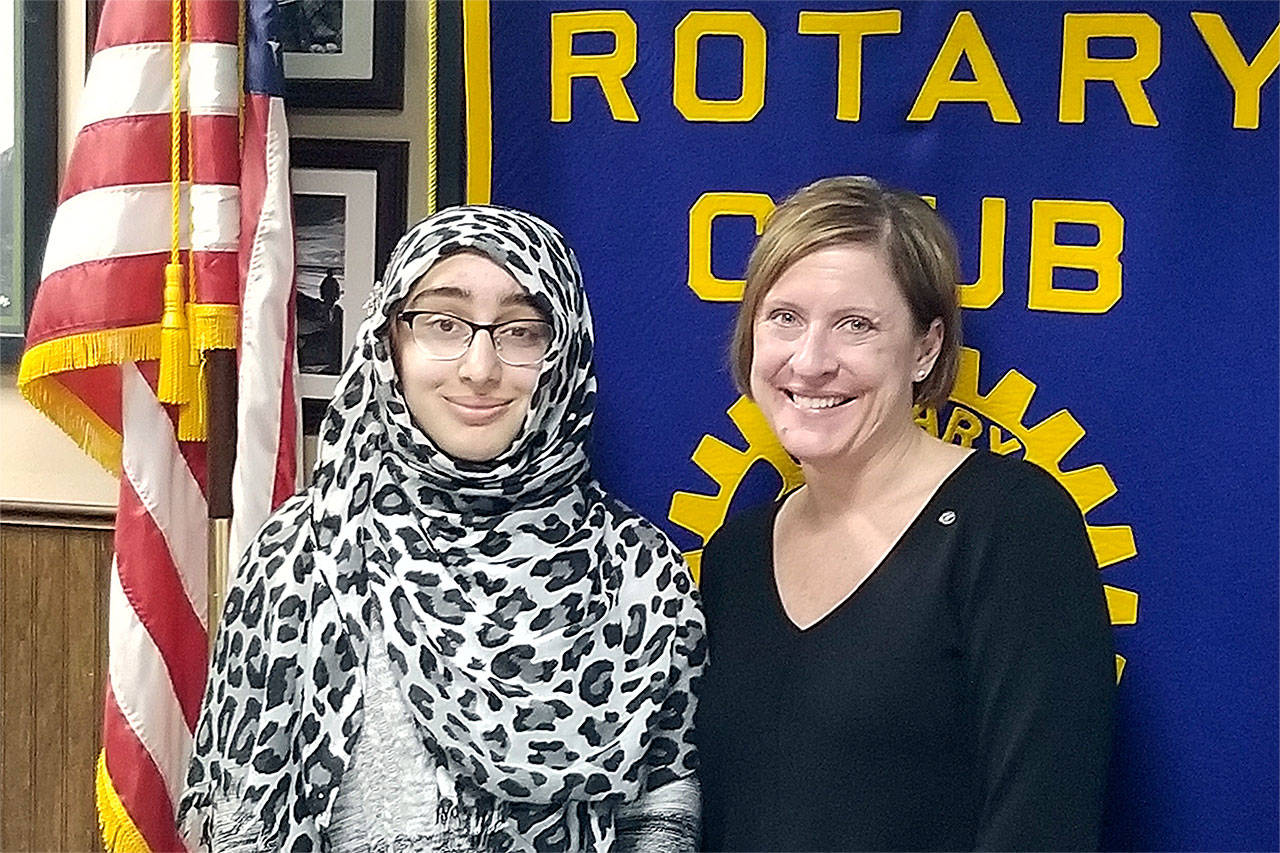 South Everett-Mukilteo Rotary Club president Julie Frauenholtz congratulates Sarah Khan on being named a Rotary Student of the Month. (Contributed photo)