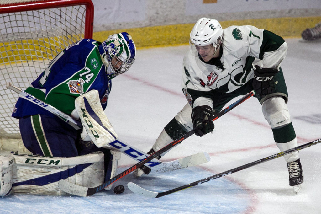 The Silvertips’ Martin Fasko-Rudas (right) works for a shot with Swift Current goalie Stuart Skinner defending during Game 5 of the WHL championship series on May 11, 2018, at Angel of the Winds Arena in Everett. (Kevin Clark / The Herald)
