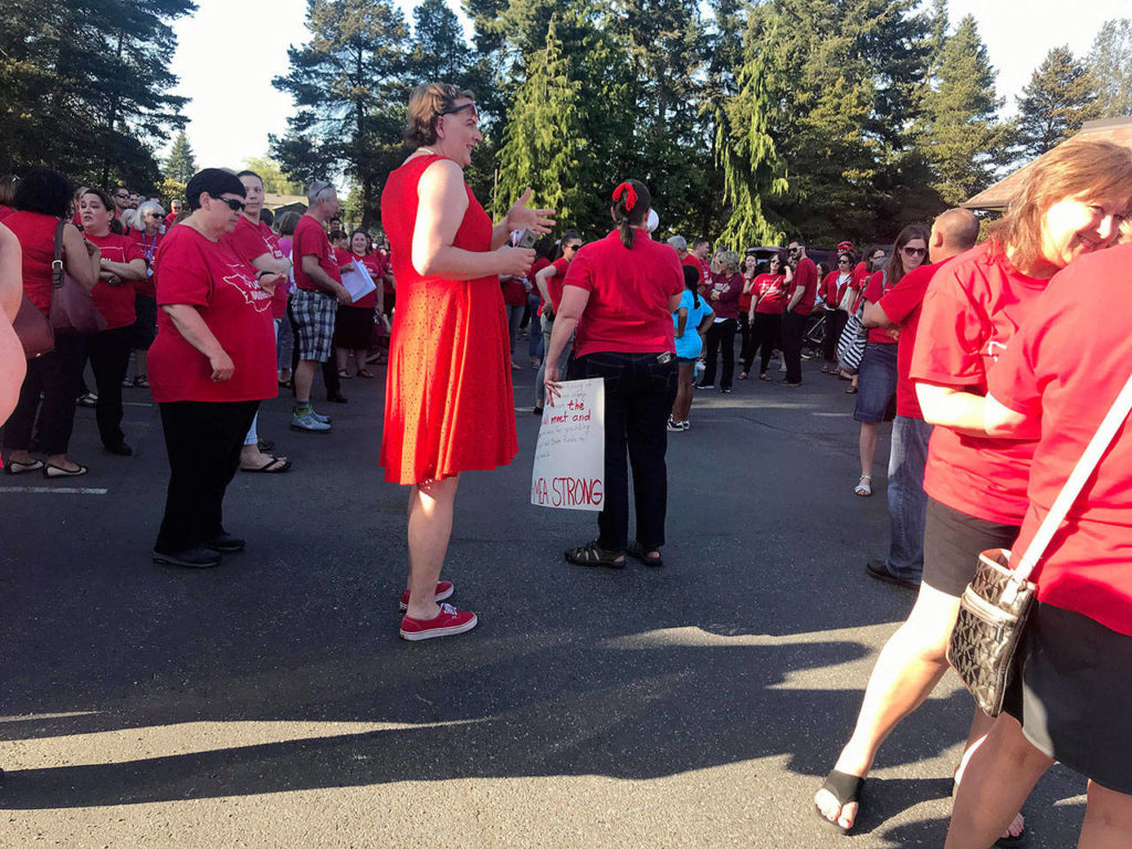 Many wore red “I Teach Washington” T-shirts. (Andrea Brown / The Herald)
