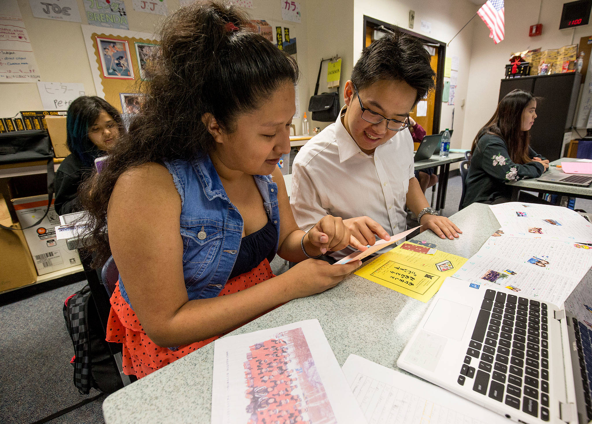 Mariner High School students April Hernandez-Diaz and Brian Pham work through a translation of a card by their pen pals from Japan. Mariner joined the pen pal project 10 years ago with Itoshima High School in Fukuoka, Japan. (Andy Bronson / The Herald)