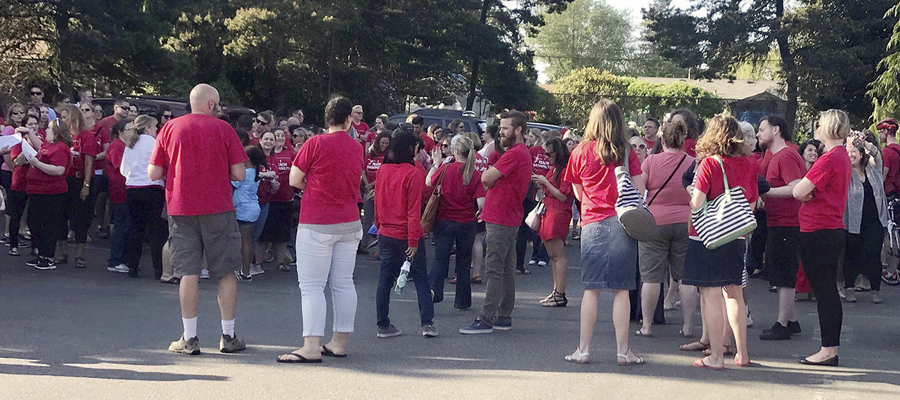 About 150 teachers and other staff packed the meeting of the Mukilteo School Board on May 14 to demand renegotiation of their contract. (Andrea Brown / Herald file)