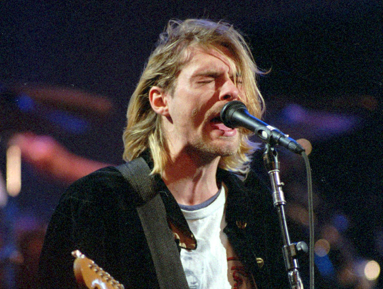 This 1993 photo shows Kurt Cobain of the band Nirvana performing in Seattle. (AP Photo/Robert Sorbo, File)