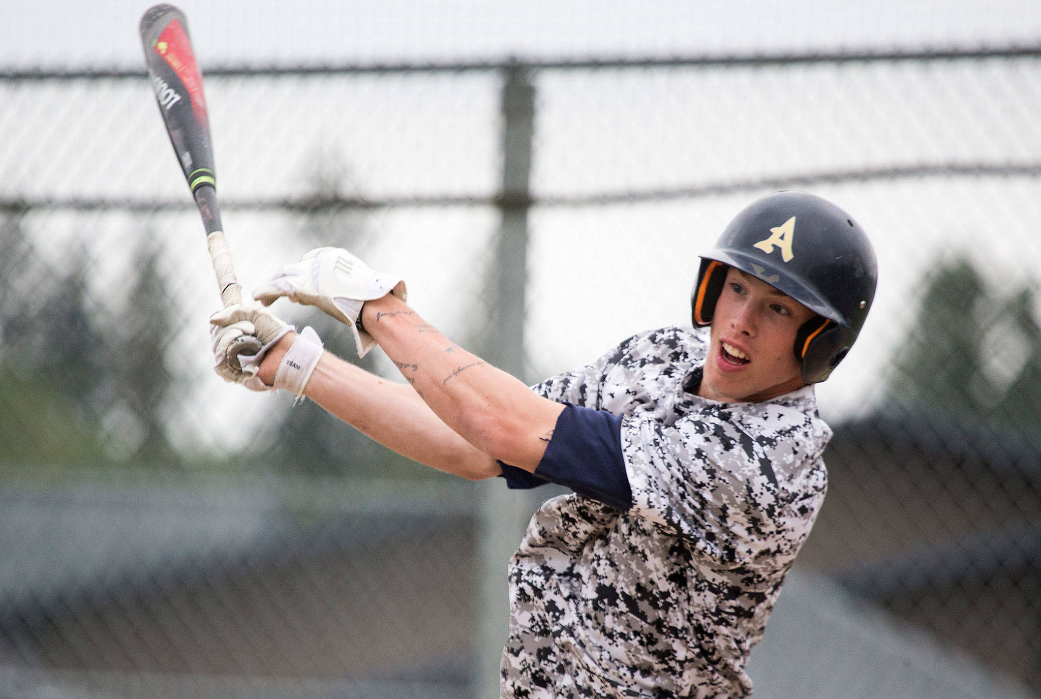 Arlington senior Gavin Rork hits during batting practice on May 17, 2018, in Arlington. (Andy Bronson / The Herald)