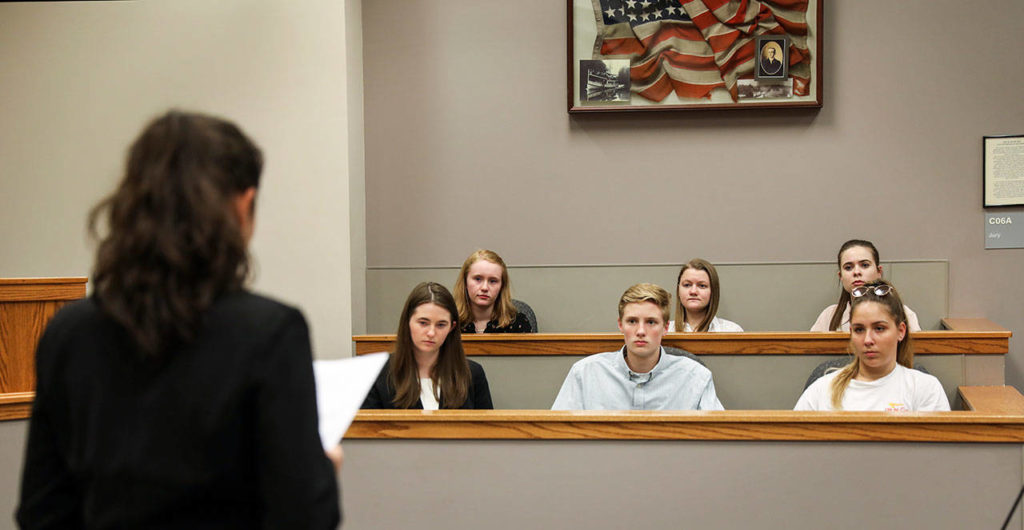 Julia Kozak questions a fellow high school student during a hearing in Bothell Youth Court. (Lizz Giordano / The Herald)
