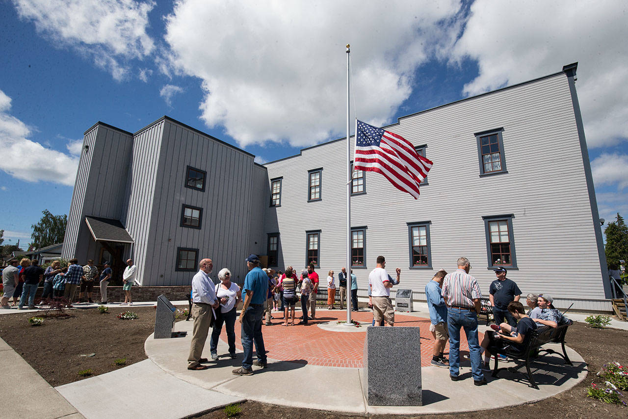 Visitors mingle after the Monday, May 28 Memorial Day dedication of the Stanwood Area Historical Society Community Veterans Memorial at the Floyd Norgaard Cultural Center. (Andy Bronson / The Herald)