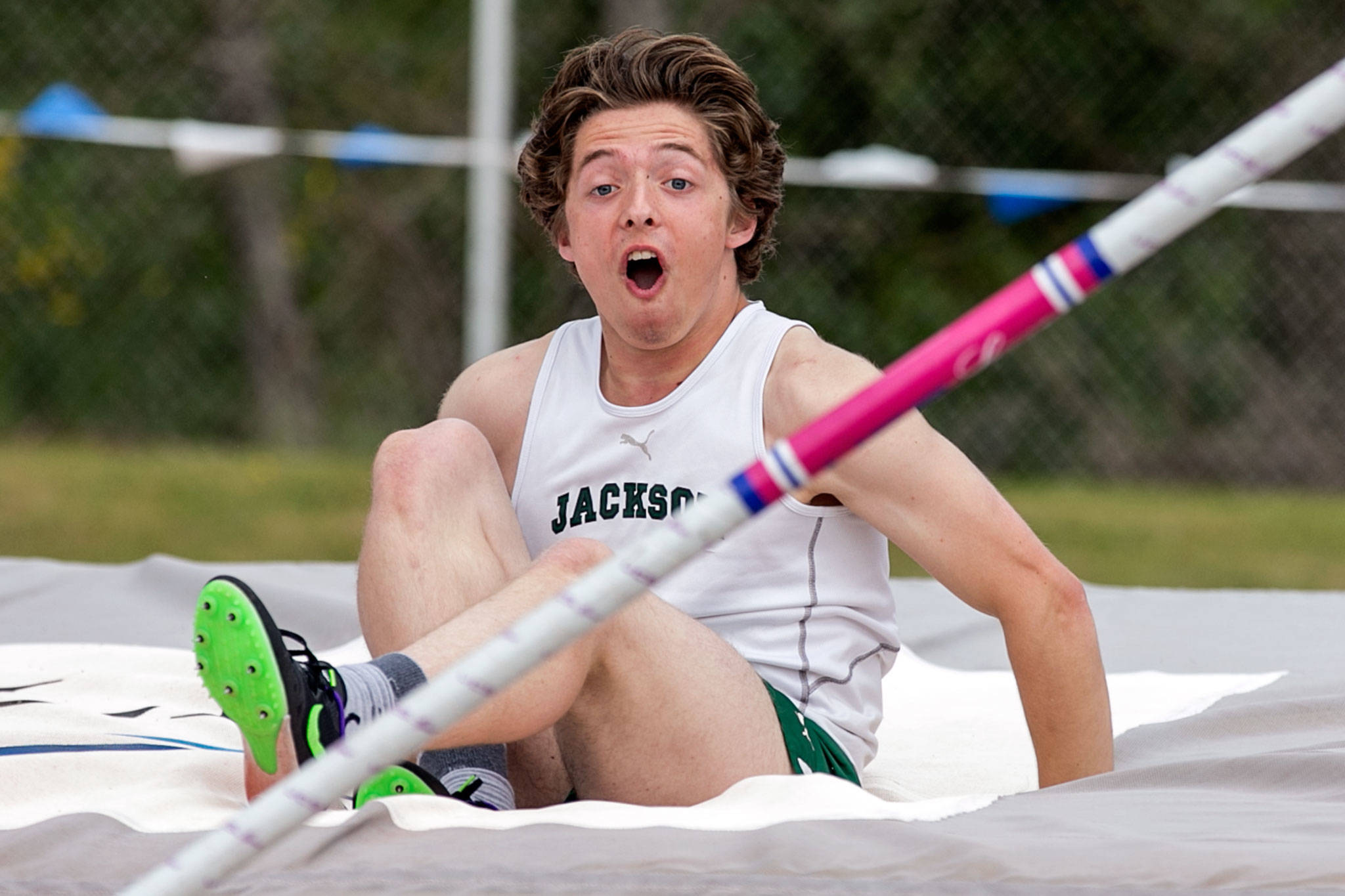 Jackson’s Dakota Burwell reacts after clearing 12 feet, 9 inches to play first in the 4A boys pole vault during the 3A/4A track and field championships Friday afternoon at Shoreline Stadium. Burwell and the Timberwolves finished second in the boys team standings. (Kevin Clark / The Herald)
