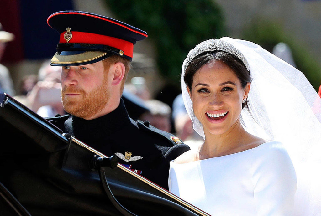 Britain’s Prince Harry and his wife, Meghan, leave after their wedding ceremony at St. George’s Chapel in Windsor Castle at Windsor, England, on Saturday. (Gareth Fuller)
