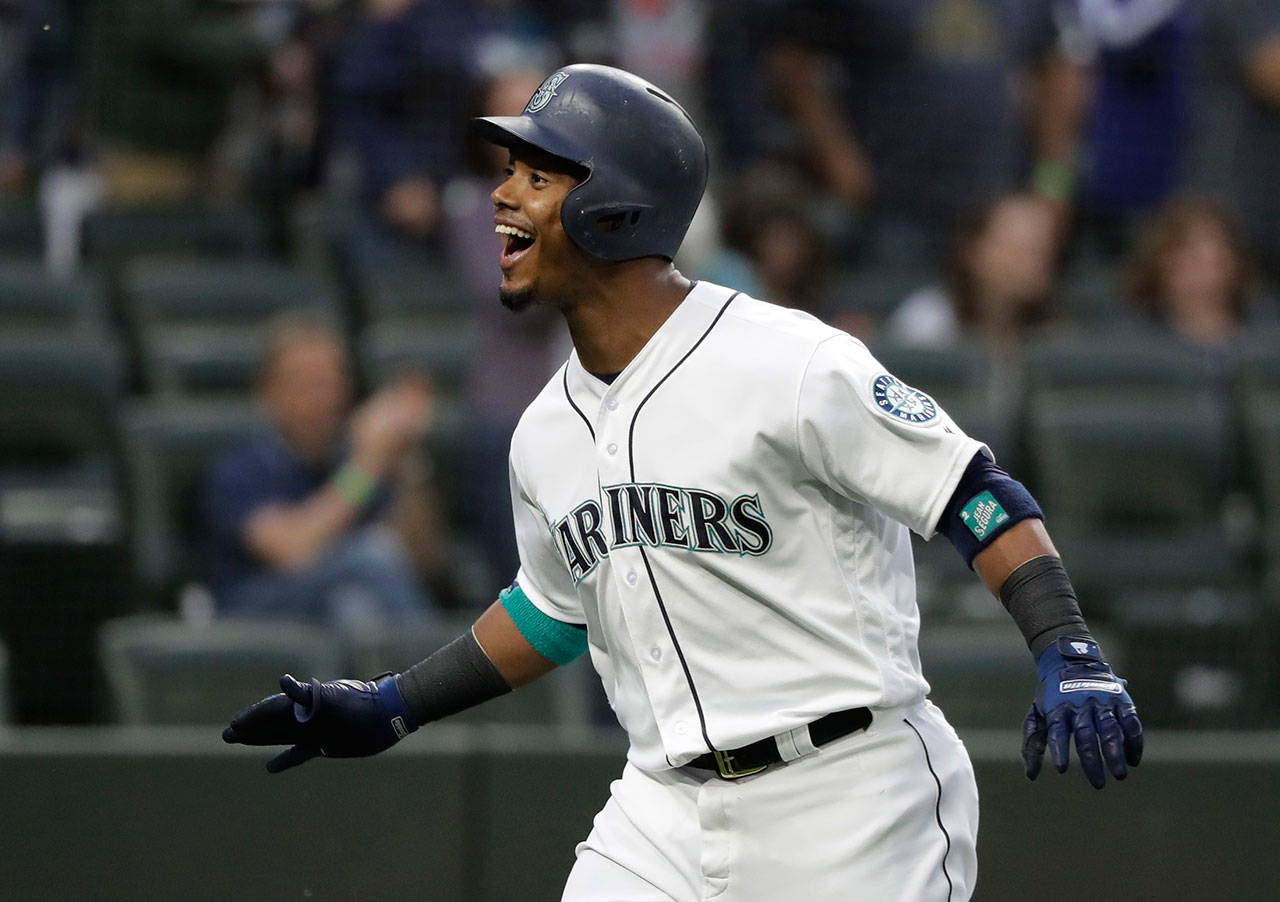 The Mariners’ Jean Segura reacts as he nears home plate after hitting a solo home run against the Tigers during the first inning of a game May 19, 2018, in Seattle. (AP Photo/Ted S. Warren)