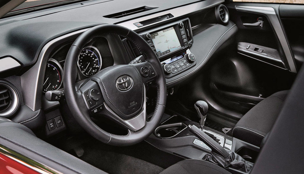 Interior features exclusive to the 2018 RAV4 Adventure include accents that look like carbon fiber, and all-weather floor and cargo mats with “RAV4 Adventure” logo badging. (Manufacturer photo)
