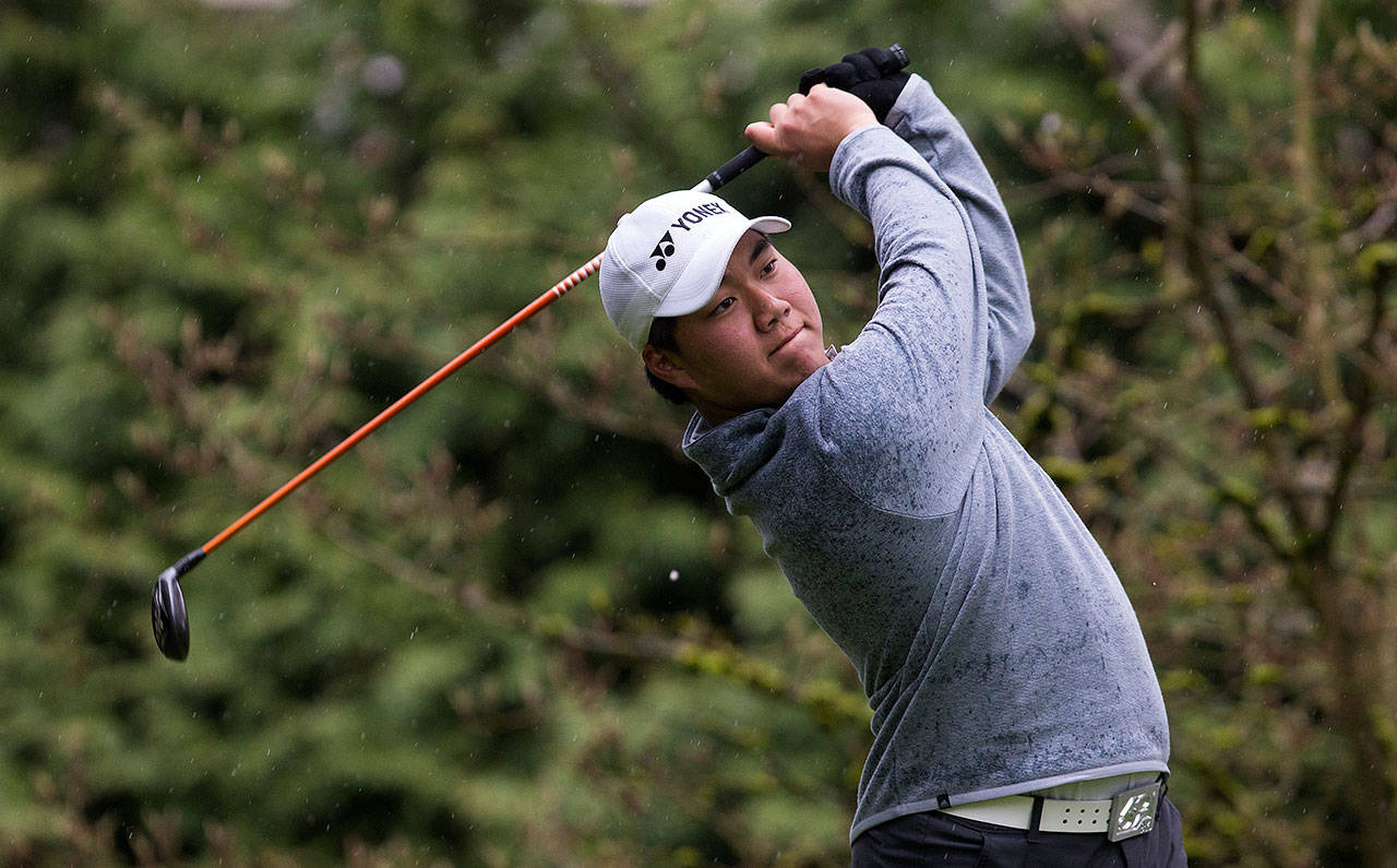 Kamiaks Alvin Kwak chips onto the green during the Dolan Invitational on Monday, April 10, 2017 at Everett Golf Country Club. Hes considered a title contender this year for the 4A state title. (Andy Bronson / The Herald)