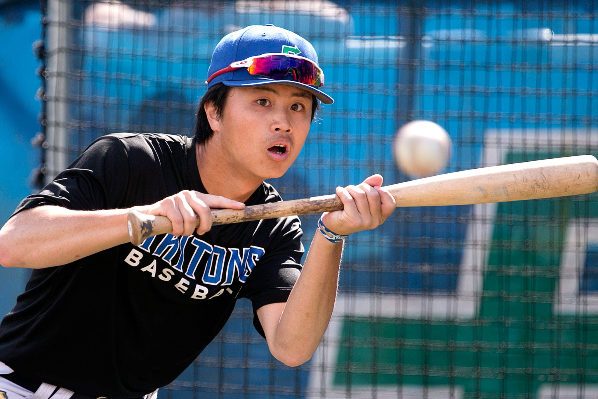 Edmonds Community College’s Yugo Hamakawa squares to bunt during the Tritons’ baseball practice May 16 in Lynnwood. (Kevin Clark / The Herald)