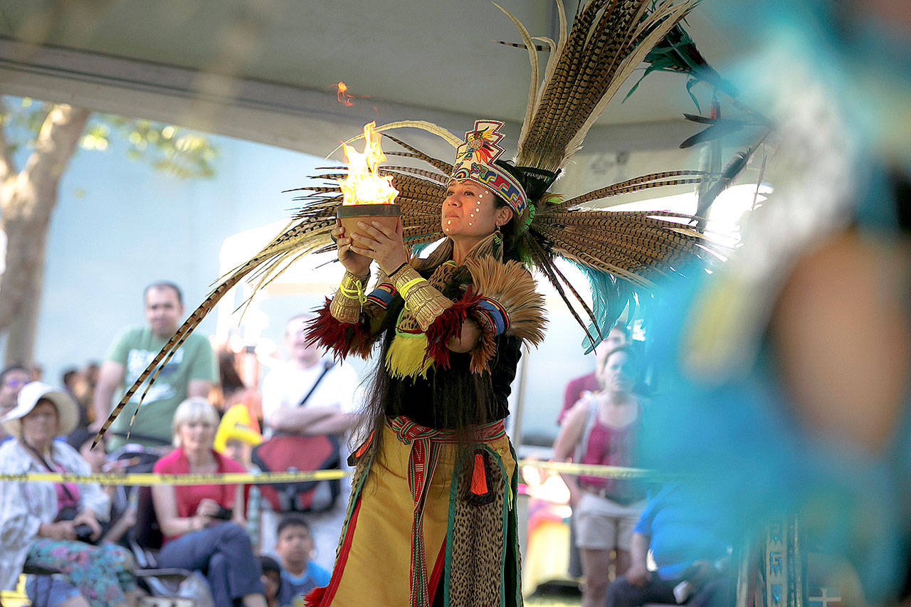 Ixtlixochitl White Hawk of Everett will demonstrate Aztec dancing at 4 p.m. Saturday at Folklife. (Christopher Nelson)