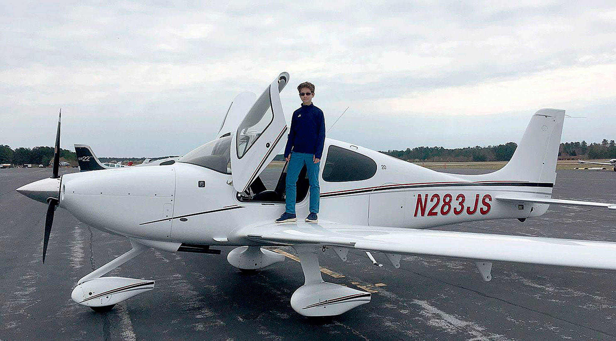 Cade Glass, 13, is seen with a Cirrus SR20 airplane during a lesson at Chesterfield County Airport near Richmond, Virginia, in March. Glass has wanted to be a pilot since he was at least 7 years old. (Scott Glass)