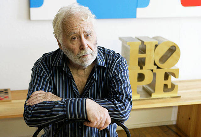 In this 2009 photo, artist Robert Indiana poses at his studio in Vinalhaven, Maine. (AP Photo/Joel Page, File)