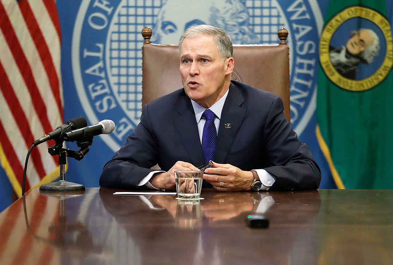 Washington Gov. Jay Inslee at a news conference on Jan. 19 in Olympia. He is headed to Iowa next month as the keynote speaker for a fundraiser at a gathering of that state’s leading Democratic officials. (AP Photo/Ted S. Warren)