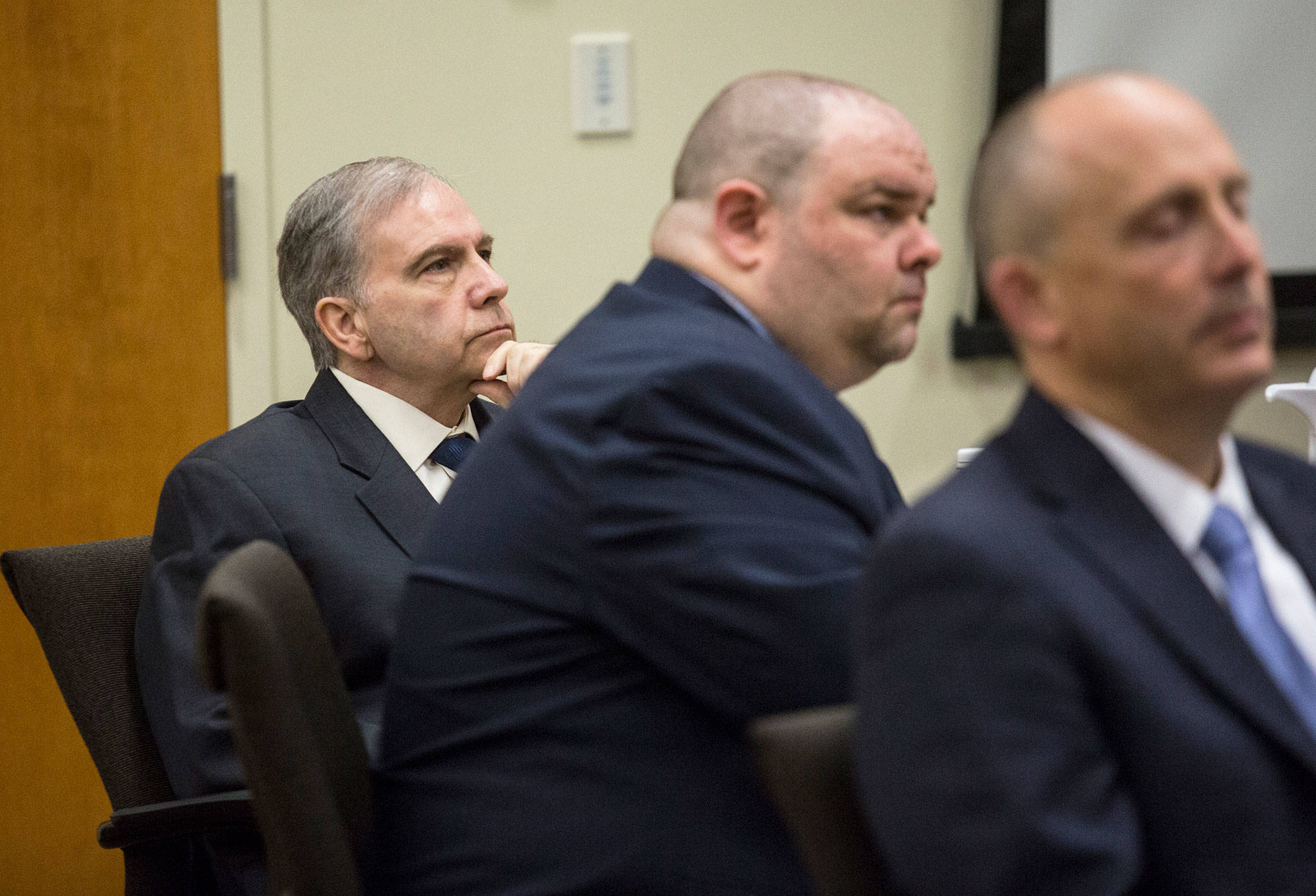 John Reed (left), charged in the murders of Monique Patenaude and Patrick Shunn, listens to opening statements during his trial at the Snohomish County Courthouse on May 10 in Everett. (Andy Bronson / The Herald)