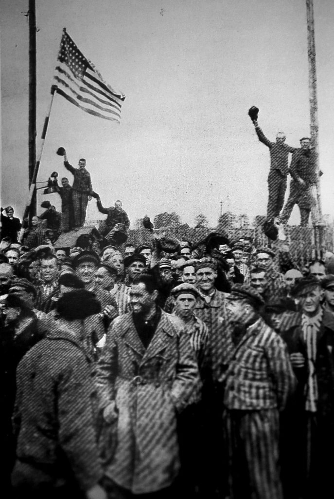 Jean Bochan treasures this photograph of the liberation of Dachau, a concentration camp in Germany, by American troops during World War II. Her late husband, a native of Poland, was imprisoned at the camp before coming to the United States as a refugee. (Courtesy of Jean Bochan)
