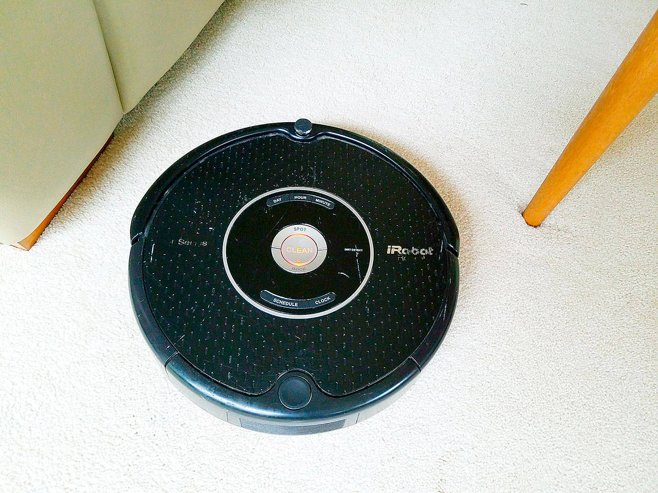 At the push of a button, Roomba sets forth to vacuum the living room. (Jennifer Bardsley)