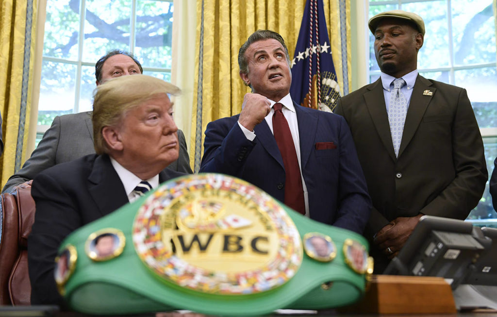 President Donald Trump and heavyweight champion boxer Lennox Lewis (right) watch as Sylvester Stallone gestures in the Oval Office of the White House on Thursday, where Trump granted a posthumous pardon to Jack Johnson, boxing’s first black heavyweight champion. (AP Photo/Susan Walsh)
