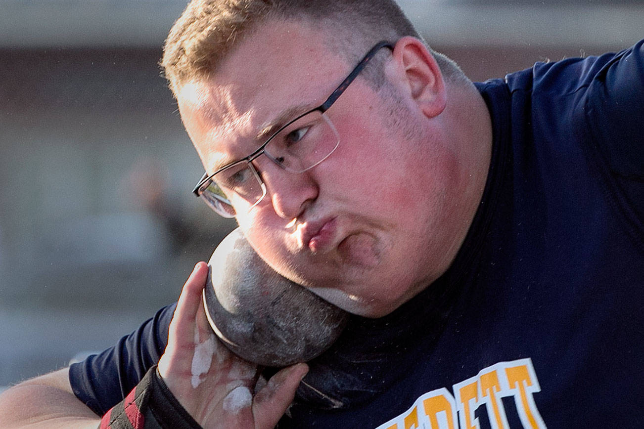 Everett’s Ben Howard competes in the shot put Thursday afternoon on the first of State Track Championship at Mount Tahoma High School in Tacoma on May 24, 2018. (Kevin Clark / The Herald)