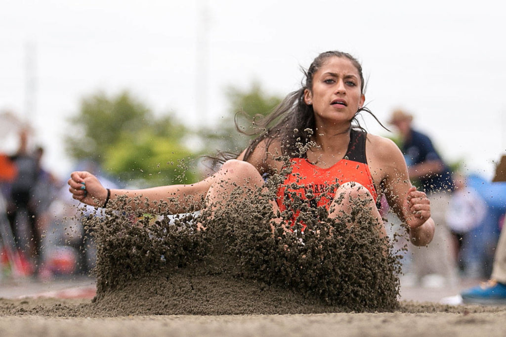 Monroe’s Hannah Ganashamoorthy competes in the 4A long jump during the state track and field championships on May 25, 2018, at Mount Tahoma High School in Tacoma. (Kevin Clark / The Herald)
