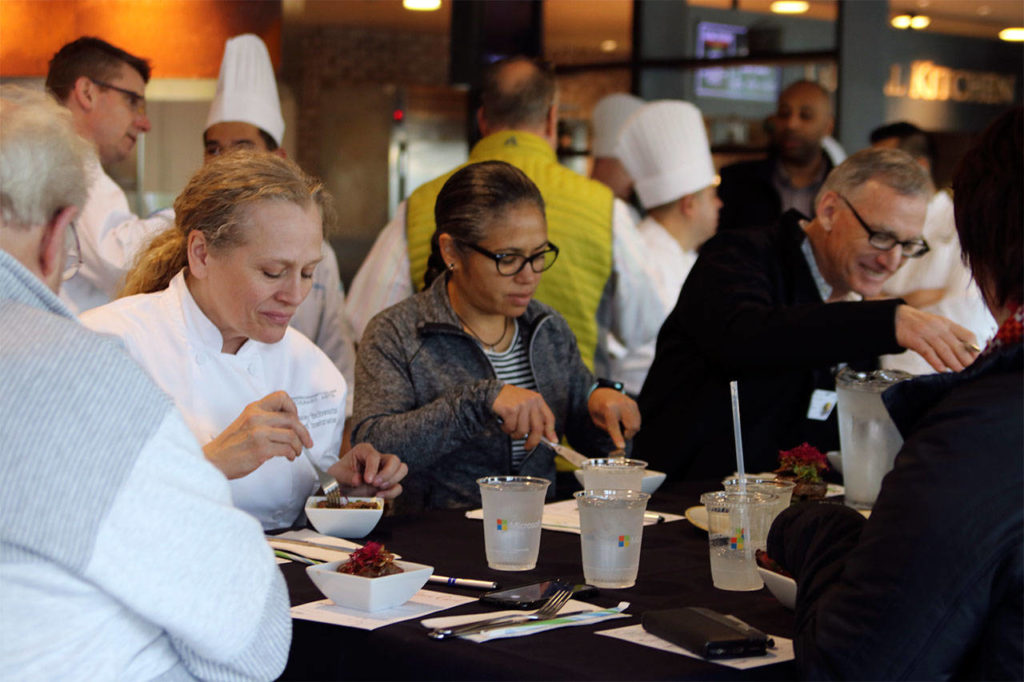 Edmonds Community College culinary instructor Stacey Schwartz, celebrity chef judge Maria Hines, and judge John Flocchini, Durham Bison Ranch owner, taste an entry. (Contributed photo)
