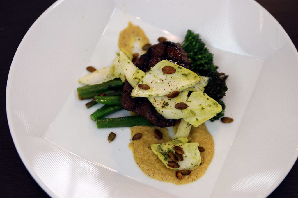 Jimenez’s winning dish featured Mexican mole marinated bison, roasted corn puree, grilled broccolini, endive salad topped with Mojo de Ajo, a chimichurri-style sauce with onions and garlic, and toasted anchovy pepitas. (Contributed photo)
