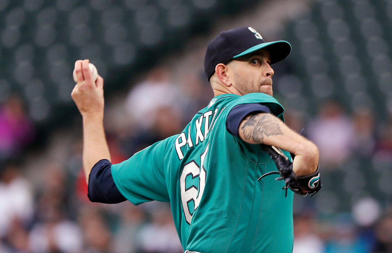 Seattle’s James Paxton throws to a Minnesota batter during the first inning of Friday’s game at Safeco Field. (AP Photo/Elaine Thompson)
