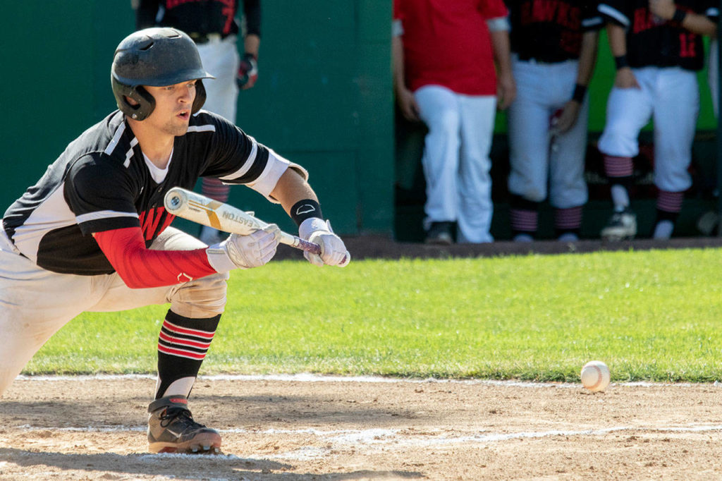 Mountlake Terrace’s Dan Bingaman (2) lays down a bunt against Ellensburg during the 2A state baseball championship game on May 26, 2018, in Yakima. Ellensburg defeated Mountlake Terrace 2-1. (TJ Mullinax/For The Herald)
