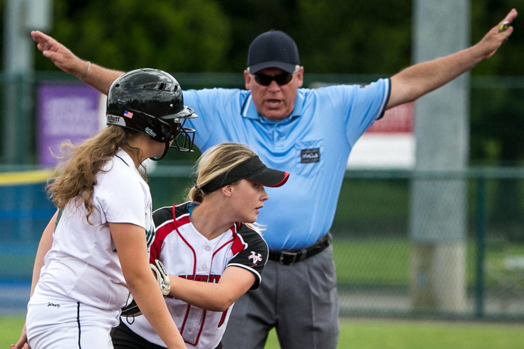 Bonney Lake’s Brynn Nelson is called safe after a tag attempt by Snohomish’s Ruby Butler on Saturday 3A softball championship game at the Regional Athletic Complex in Lacey. (Kevin Clark / The Herald)
