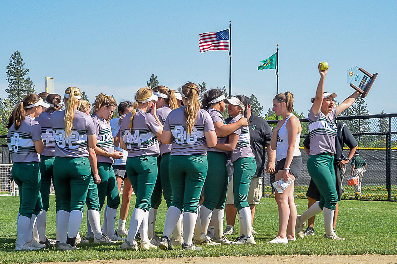 Jackson players celebrate a 6-3 win over Monroe in the 4A state softball championship game on May 26, 2018, at Merkel Sports Complex in Spokane. (Bridget Mayfield/Pescado Lago Studios)