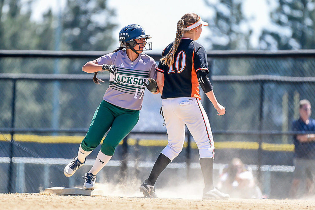 Jackson’s Jessica Asantor (left) rounds second base during the 4A state softball championship game against Monroe on May 26, 2018, at Merkel Sports Complex in Spokane. (Bridget Mayfield/Pescado Lago Studios)
