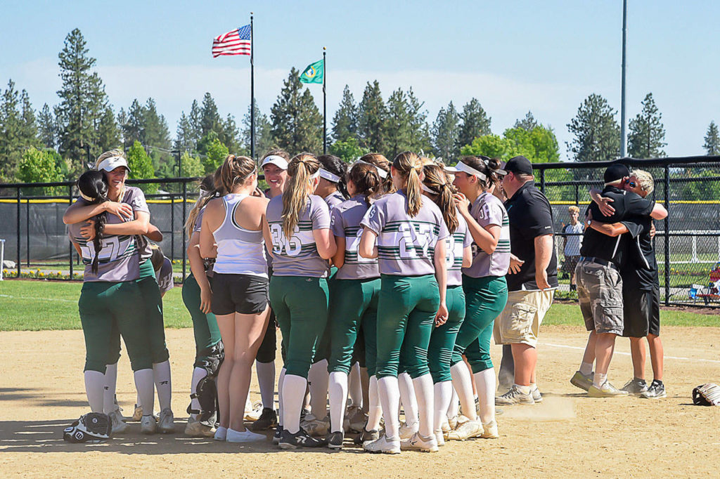 Jackson players celebrate a 6-3 win over Monroe in the 4A state softball championship game on May 26, 2018, at Merkel Sports Complex in Spokane. (Bridget Mayfield/Pescado Lago Studios)
