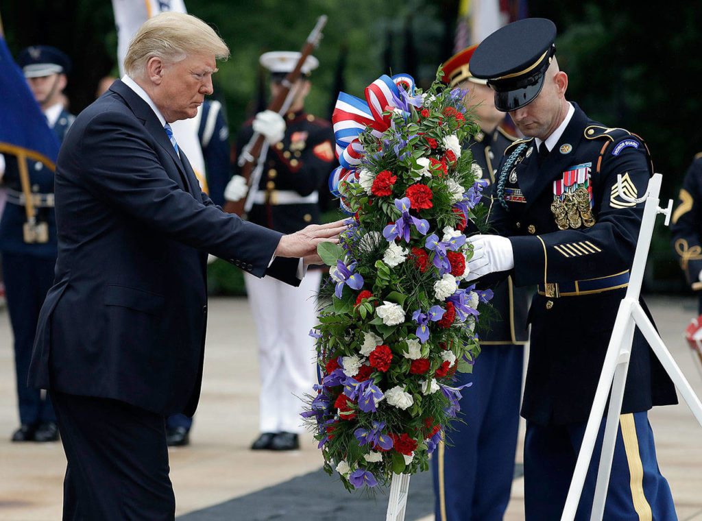 President Donald Trump lays a wreath at the Tomb of the Unknown Soldier at Arlington National Cemetery on Monday in Arlington, Virginia. (AP Photo/Evan Vucci)
