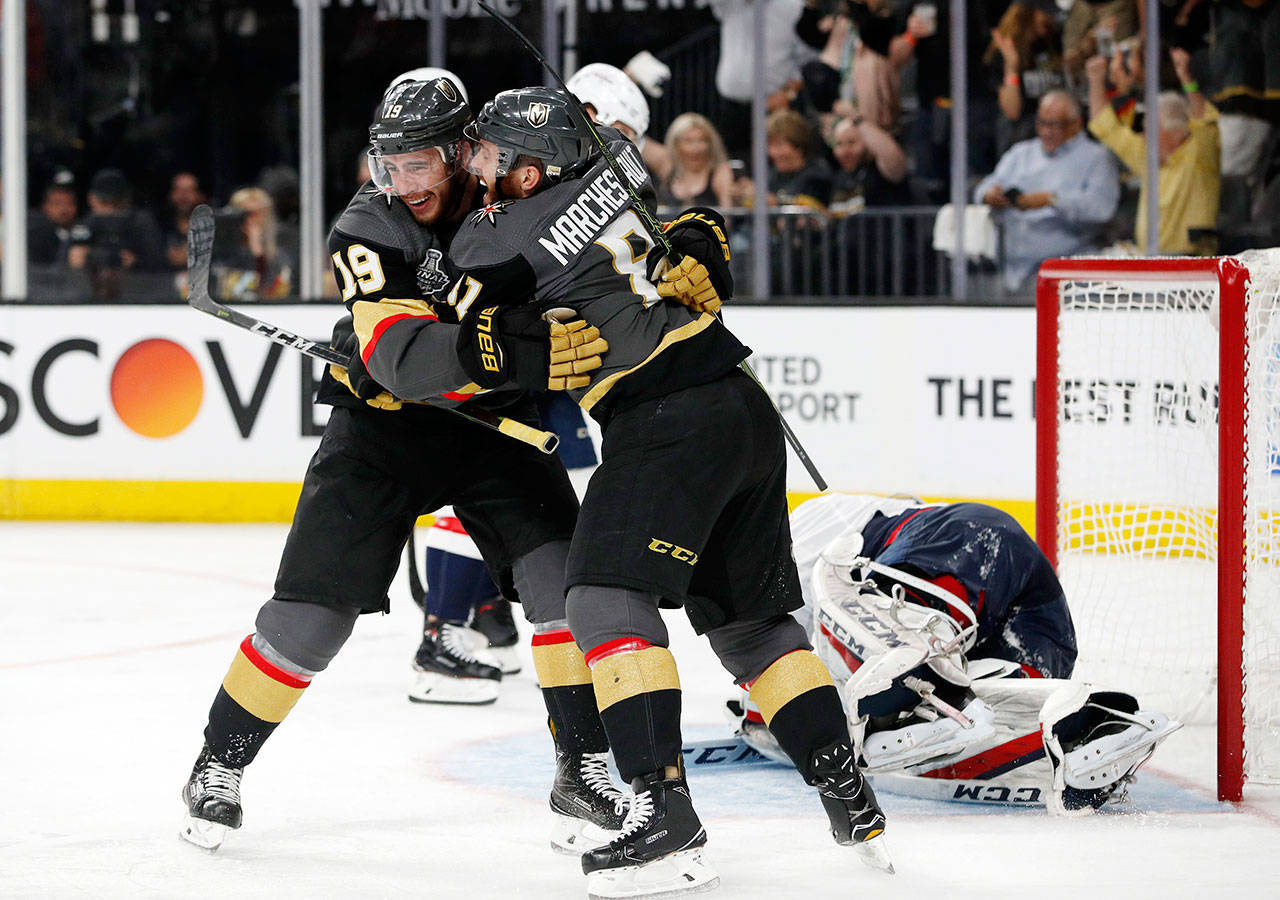 Vegas’ Reilly Smith (left) celebrates his goal with teammate Jonathan Marchessault during second period of Monday’s game in Las Vegas. (AP Photo/John Locher)