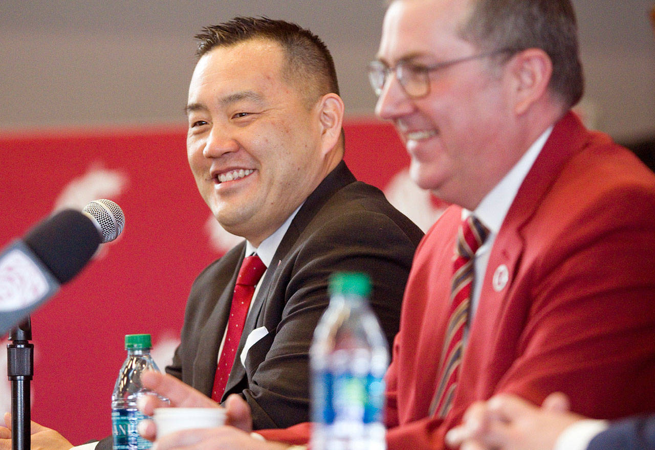 In this Jan. 23, 2018, file photo Washington State University President Kirk Schulz (right) and the university’s new athletic director, Patrick Chun, answer questions during a press conference in Pullman. Chun is presenting a plan the school says will eventually tackle an athletics department budget deficit expected to grow to more than $85 million. (Geoff Crimmins/The Moscow-Pullman Daily News via AP, File)