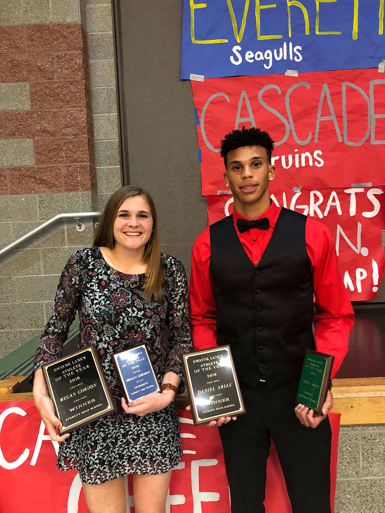 Everett School District photo                                Everett’s Megan Gordon (left) and Jackson’s Daniel Arias were the recipients of $2,500 scholarships from Dwayne Lane’s at the Everett School District athletic banquet Thursday at Jackson High School in Mill Creek.