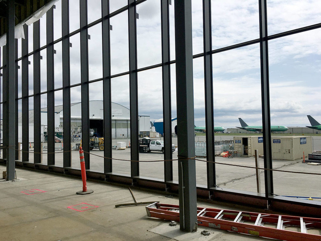 The passenger terminal at Paine Field in Everett features large windows that look out to the airport. (Janice Podsada / The Herald) 
