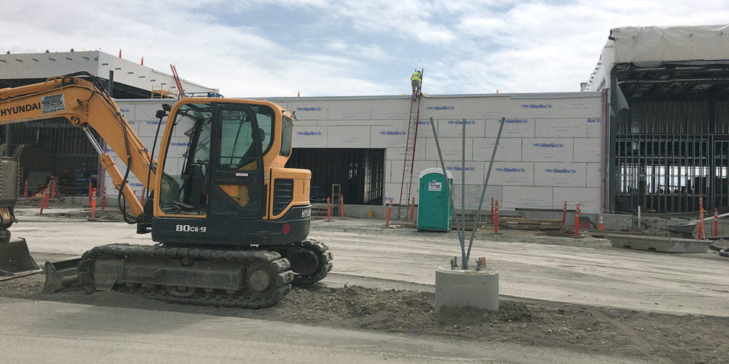 The new passenger terminal at Paine Field. The ticketing and check-in area will be on the right, and baggage claim will be on the left. (Janice Podsada / The Herald)
