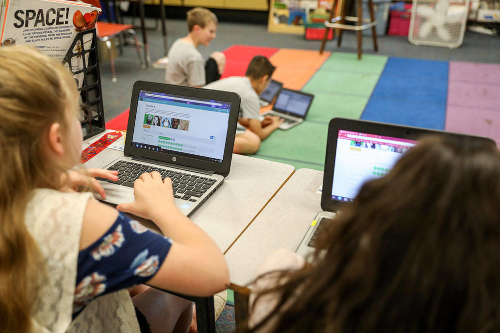 Students at Pinewood Elementary School learn to program using Chromebooks. (Lizz Giordano / The Herald)
