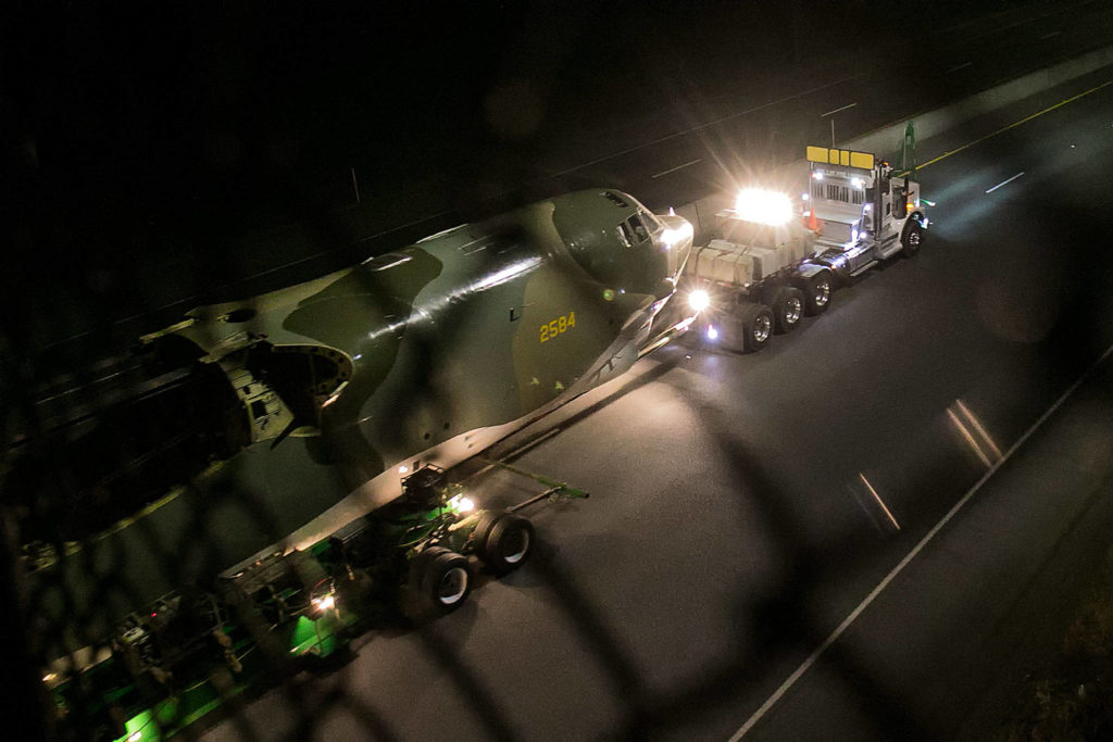 The B-52 “Midnight Express” is towed along Highway 525 from Paine Field en route to Boeing Field in Seattle early Sunday morning. (Kevin Clark / The Herald)
