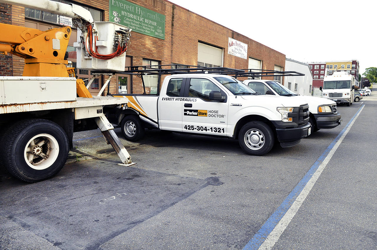 Aalbu Brothers and Everett Hydraulics in the 2900 block of Grand Avenue have reserved parking marked on the street with blue paint. (Sue Misao / Everett Herald)