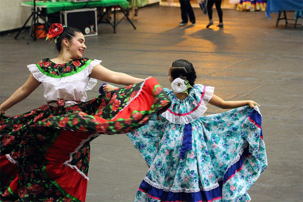 Leticia Ibarra, 12, and Devani García, 8, perform at a Festival of World Cultures, held May 18 at Totem Middle School in Marysville. (Contributed photo)
