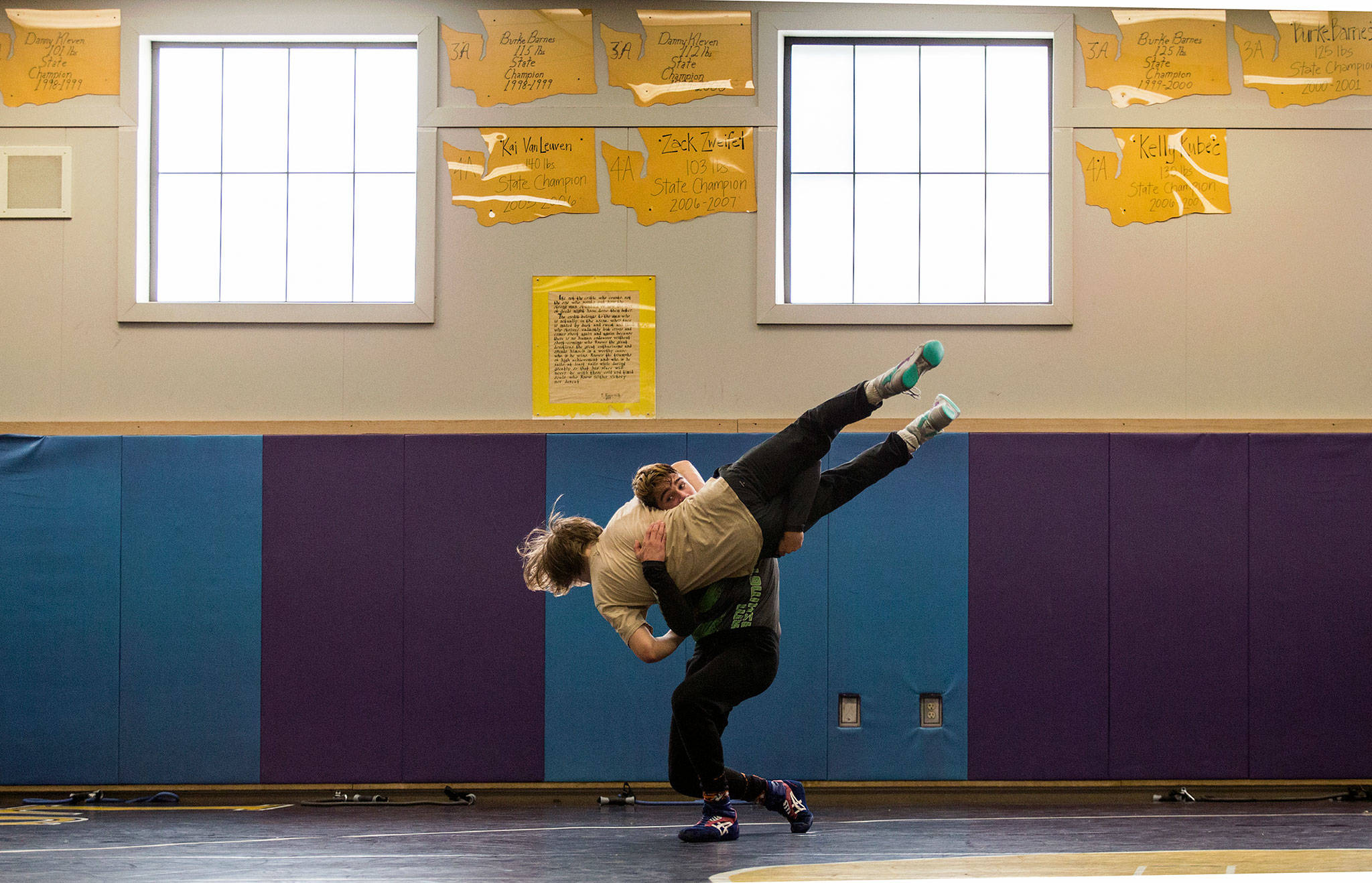 Team Washington member Hayden Long, of Granite Falls, takes down teammate Wyatt Springer, of Lake Stevens, during a workout Tuesday at Lake Stevens High School. (Andy Bronson / The Herald)