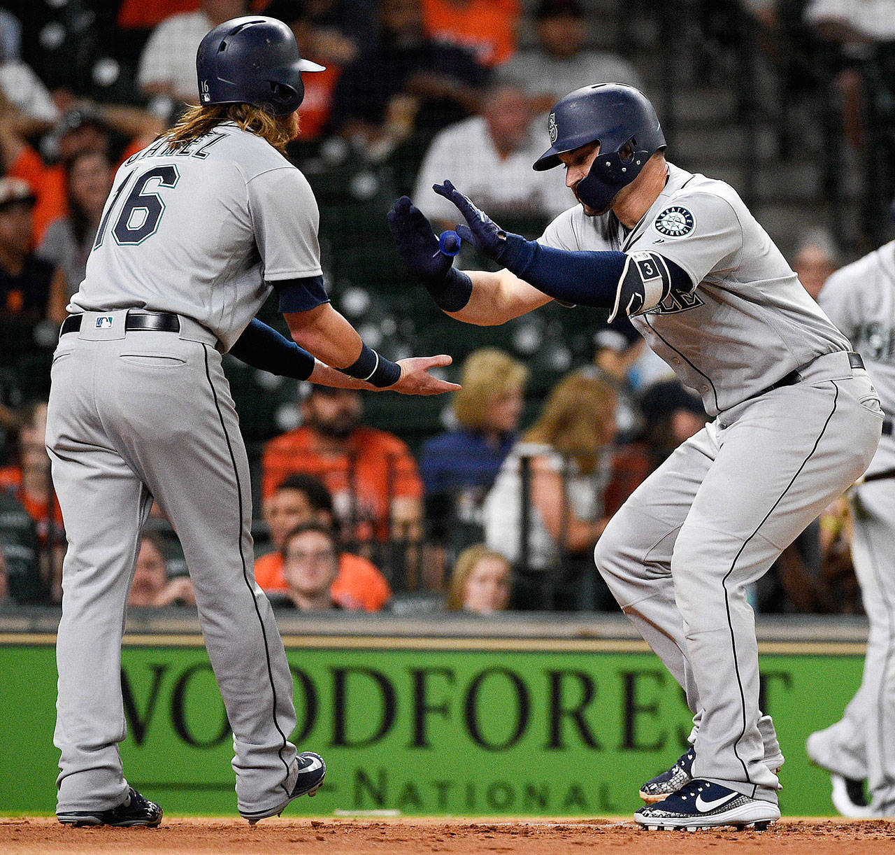 The Mariners’ Mike Zunino (right) celebrates his two-run home run with Ben Gamel during the second inning of a game against the Astros on June 5, 2018, in Houston. (AP Photo/Eric Christian Smith)
