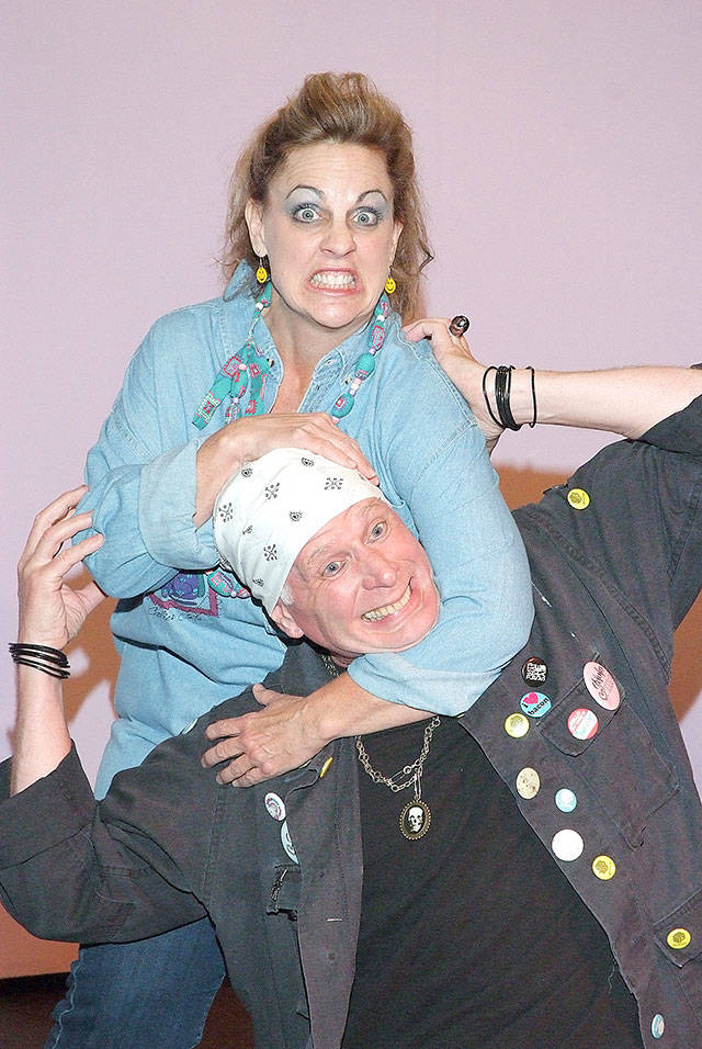 Angry housewife Carol (Jenny Price) takes out her aggression on club owner Lewd Fingers (Christopher Bartness) in “Angry Housewives.” (Photo by Kenny Randall)