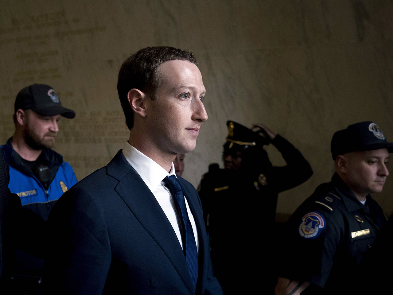 In this April 11 photo, Facebook CEO Mark Zuckerberg departs after testifying before a House Energy and Commerce hearing on Capitol Hill in Washington about the use of Facebook data to target American voters in the 2016 election and data privacy. (AP Photo/Andrew Harnik, File)
