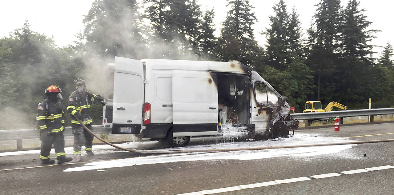 A van caught fire near the Highway 526 exit toward Boeing on Thursday morning. (Laurel Cheap)